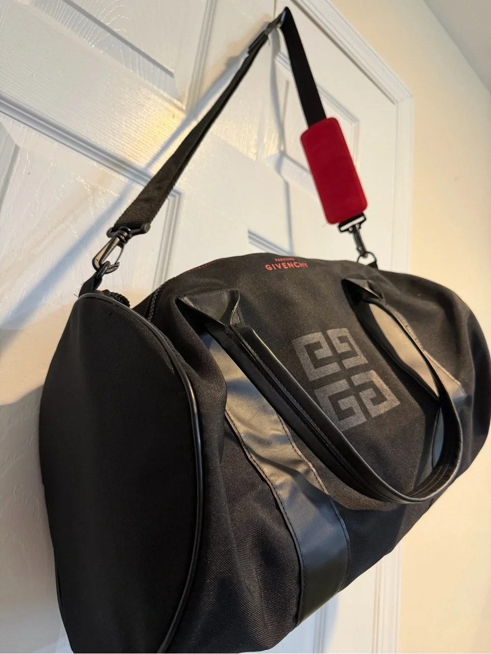 Givenchy Parfums Black Duffel Bag with Red Shoulder Pad